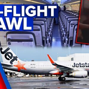 Passengers escorted off plane after mid-air brawl on Jetstar flight | 9 News Australia