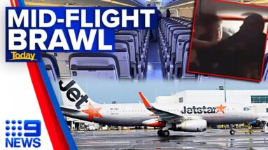 Passengers escorted off plane after mid-air brawl on Jetstar flight | 9 News Australia